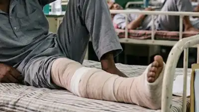 3 months after encounter, 25yo undertrial with broken bone awaits implant; depts cite 'budgetary