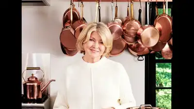 Stewart lined the hallway between her kitchen and library with deep black shelves, perfect