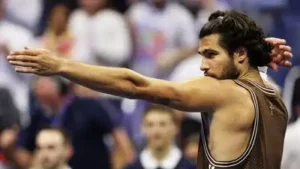 Defending champion Carlos Alcaraz recovered from an early wobble to reach the third round