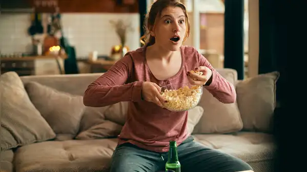 the research does not suggest that watching something while eating automatically makes you
