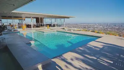 Perched high in the Hollywood Hills, this glass-and-steel mid-century home once seemed