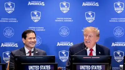 US President Donald Trump speaks next to US Secretary of State Marco Rubio during a Shield