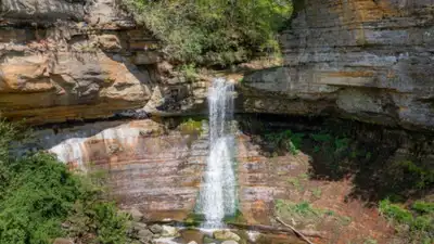 An Illinois waterfall and canyon photographed as a tourist attraction in 1903 remained largely