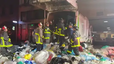 A San Francisco bystander heard screams from a garbage truck after its load had been compacted; 25