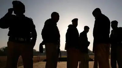 Gunmen shot dead two police officers protecting polio vaccination workers in Pakistan's