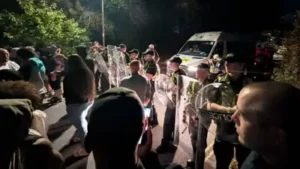 cops injured and several vehicle damaged/Image: AP — UK Anti-migrant protest