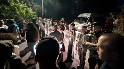 cops injured and several vehicle damaged/Image: AP — UK Anti-migrant protest