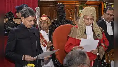 Governor RN Ravi administers the oath of office to Justice Ravindra Vithalrao Ghuge as