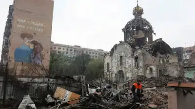 A rescuer walks past a church destroyed by a Russian air strike, (Photo: Reuters)