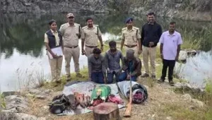 Karnataka forest officials with the 70kg of deer meat, country-made gun and hunting weapons