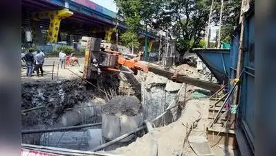 Hydraulic crane topples at Thane elevated freeway worksite, auto driver and passenger injured