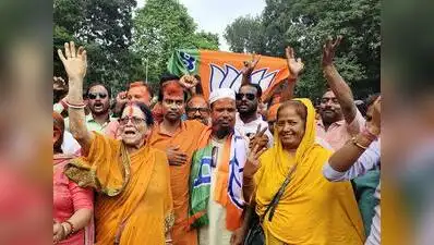 BJP activists celebrate the party’s victory in the Rejinagar bypoll on Friday