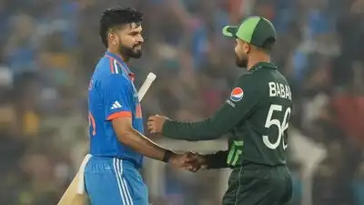 Shreyas Iyer being congratulated by Pakistan's captain Babar Azam after winning the ICC Men's