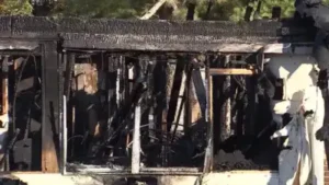 A driver headed home to Alabama took a wrong turn in Georgia and spotted a house on fire, then