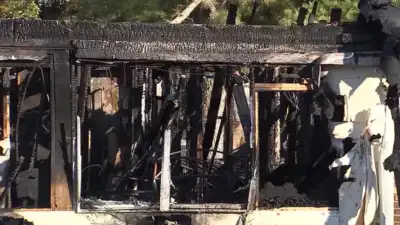 A driver headed home to Alabama took a wrong turn in Georgia and spotted a house on fire, then