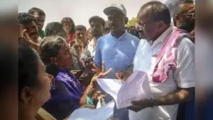 Union minister and JD(S) state president HD Kumaraswamy interacts with farmers who lost