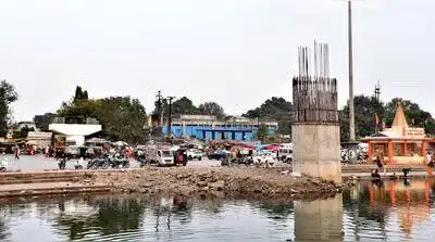 Construction of the proposed Ram Jhula pedestrian bridge progresses on the Godavari river