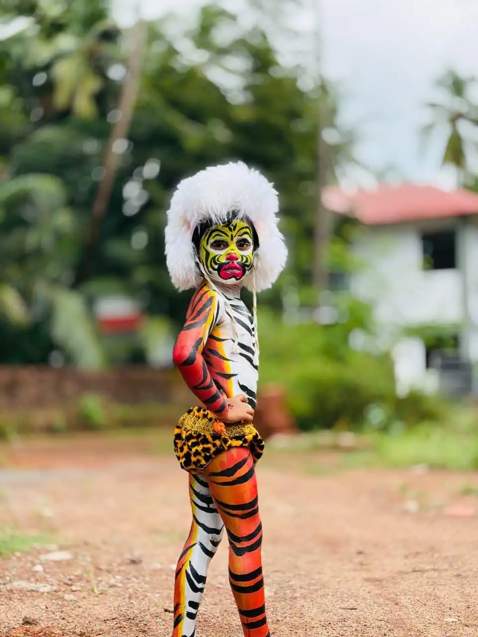 A young participant strikes a pose during a kinni pili competition at Kudroli Sri Gokarnanatha