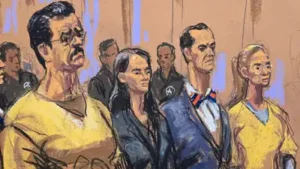Ousted Venezuelan President Nicolas Maduro and his wife, Cilia Flores, stand with Maduro's