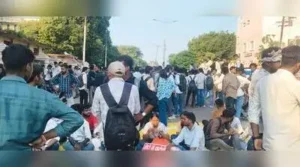 large number of students of AU protested at the campus and on the main road in front of AU's
