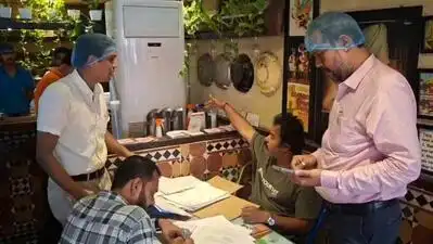 Food safety department officials raid a restaurant in Salt Lake, near City Centre on Saturday