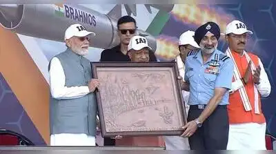 Modi wore a white IAF cap and dark sunglasses