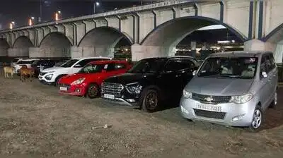 Madurai's partially cleared Vaigai riverbed is being used as a parking lot for customers of two