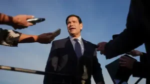 Secretary of State Marco Rubio speaks to the press before boarding a plane at Eleftherios