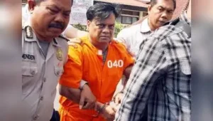 File pic of Chhota Rajan being escorted by plain-clothed police officers for questioning