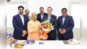 Members of the Hinduja group with CM Yogi Adityanath