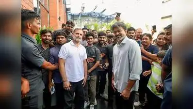 Rahul Gandhi and C Joseph Vijay interact with staff members and pose for photographs