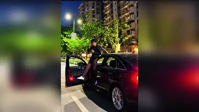 A video showing a youth standing on the footboard of a moving car with one leg outside has gone