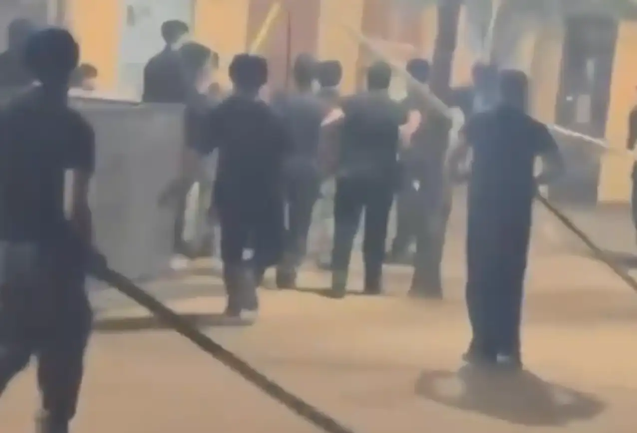 Video grab of bouncers attacking revellers with swords, sticks and chains at garba venue