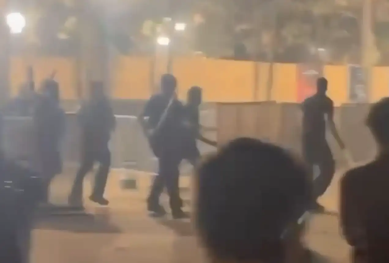 Video grab of bouncers attacking revellers with swords, sticks and chains at garba venue