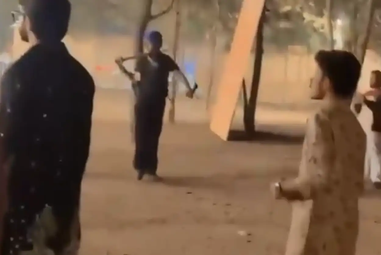 Video grab of bouncers attacking revellers with swords, sticks and chains at garba venue