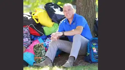 Rob Scheer began packing backpacks at home after seeing his newly adopted foster children