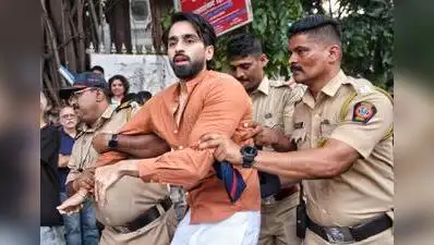 Pune police personnel detain students and other protesters during an agitation demanding