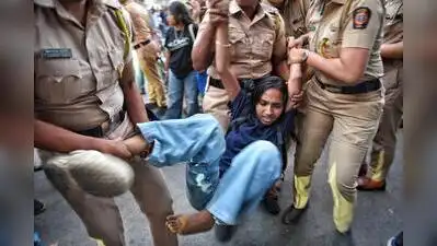 Pune police personnel detain students and other protesters during an agitation demanding