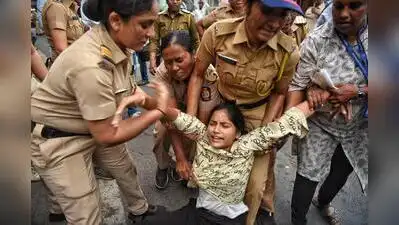 Pune police personnel detain students and other protesters during an agitation demanding