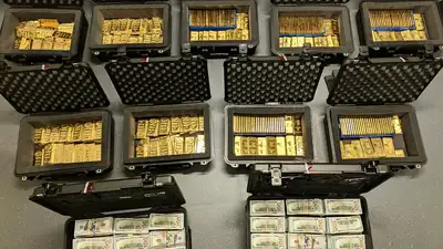 Federal executive created fake program, diverted $145M; FBI found 298 gold bars in $193.6M