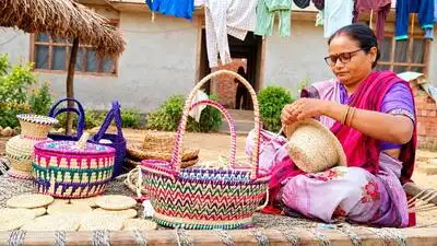 A group of traditionally dressed tharu women welcoming tourists at a home stay