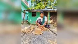 A group of traditionally dressed tharu women welcoming tourists at a home stay