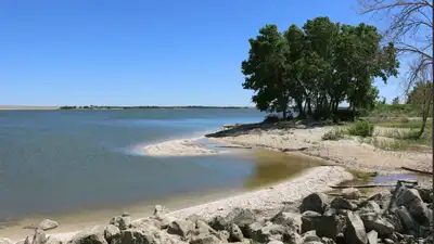 A Kansas couple wanted a beach without leaving home, so they turned two acres of their Olathe