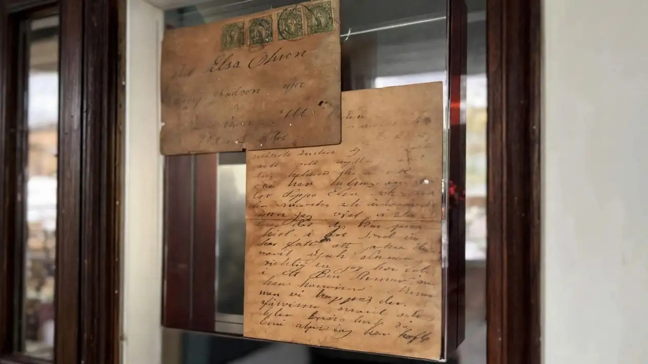 A couple found a sealed 112-year-old letter hidden inside their Illinois home's wall; it was