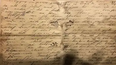 A couple found a sealed 112-year-old letter hidden inside their Illinois home's wall; it was