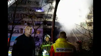Woman killed, 3 injured as Russian attack hits Kyiv residential building, subway station