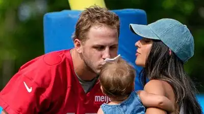 Jared Goff, kisses his daughter Romy Isabelle Goff, 1, with his wife Christen Harper USA TODAY