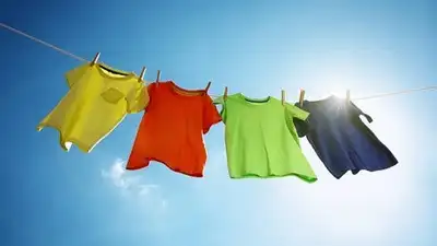 A dehumidifier in a small room pulls the moisture out of the air and can dry clothes much faster