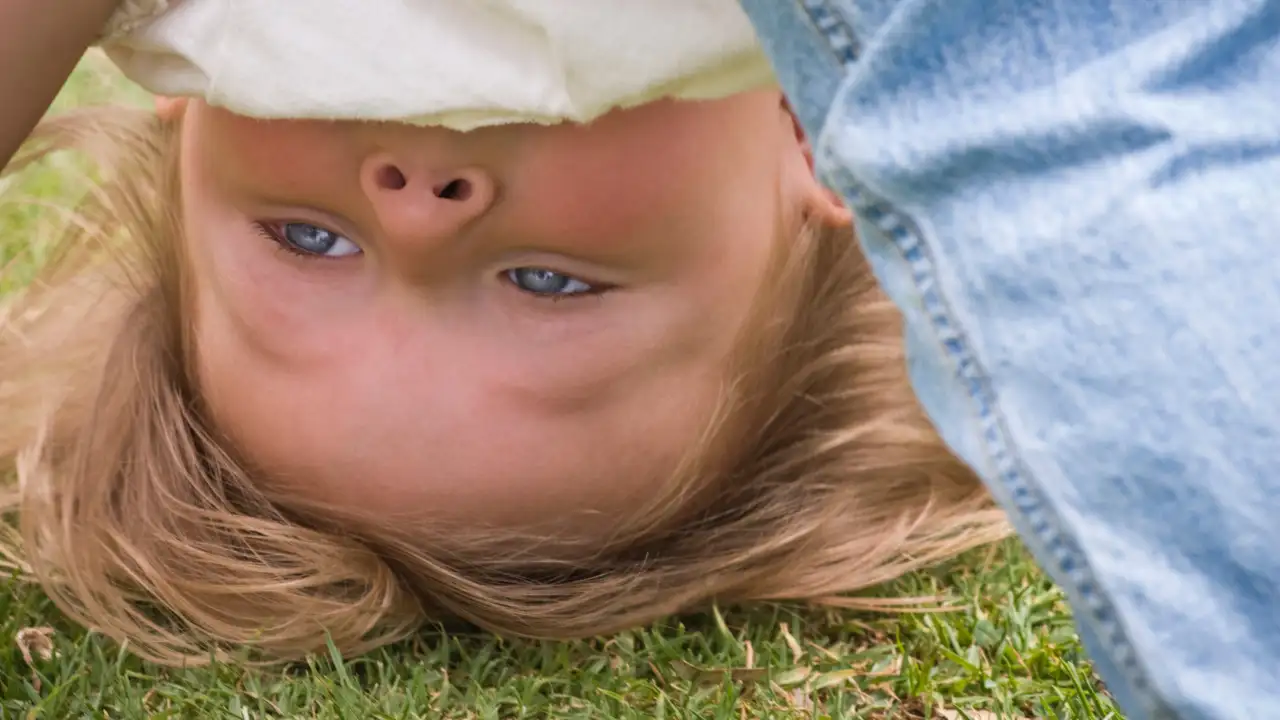 You may have seen your child bend forward, tuck their head between their legs and look