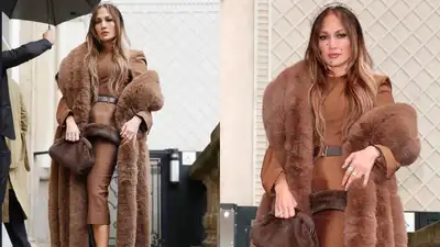 Jennifer Lopez arrived at Paris Fashion Week in the rain, but that clearly wasn’t going to stop